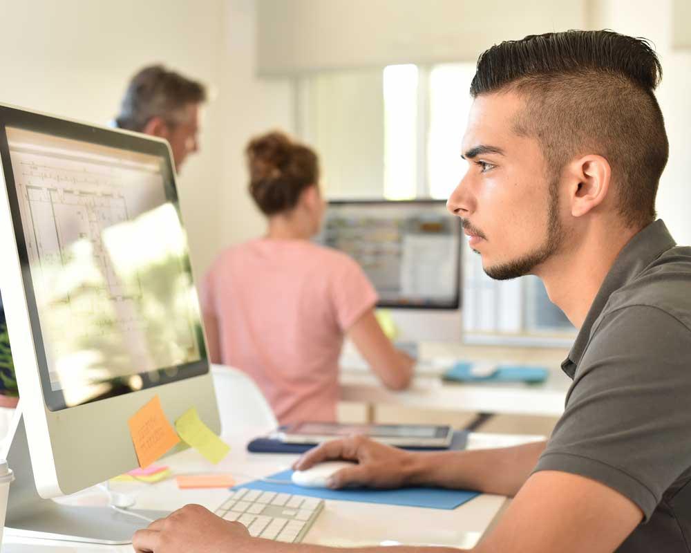 Freight forwarder sitting at a computer