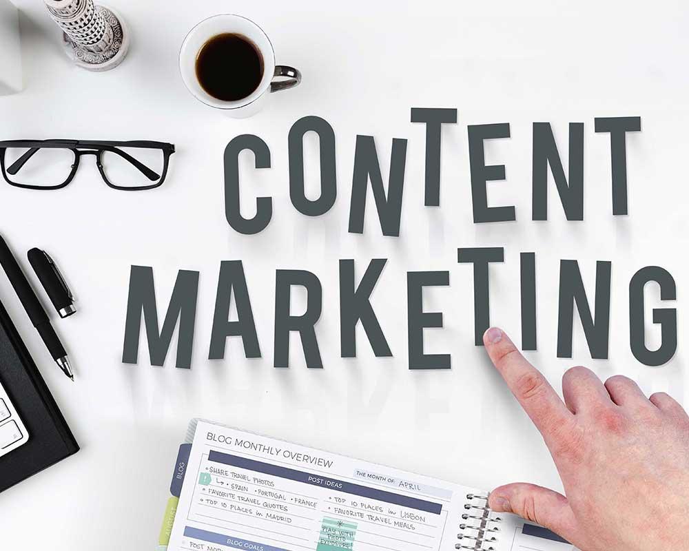 Desk top with letters spelling out Content marketing