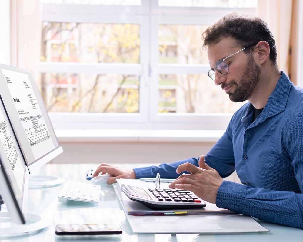 Tax apprentice using a calculator
