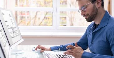 Tax apprentice using a calculator