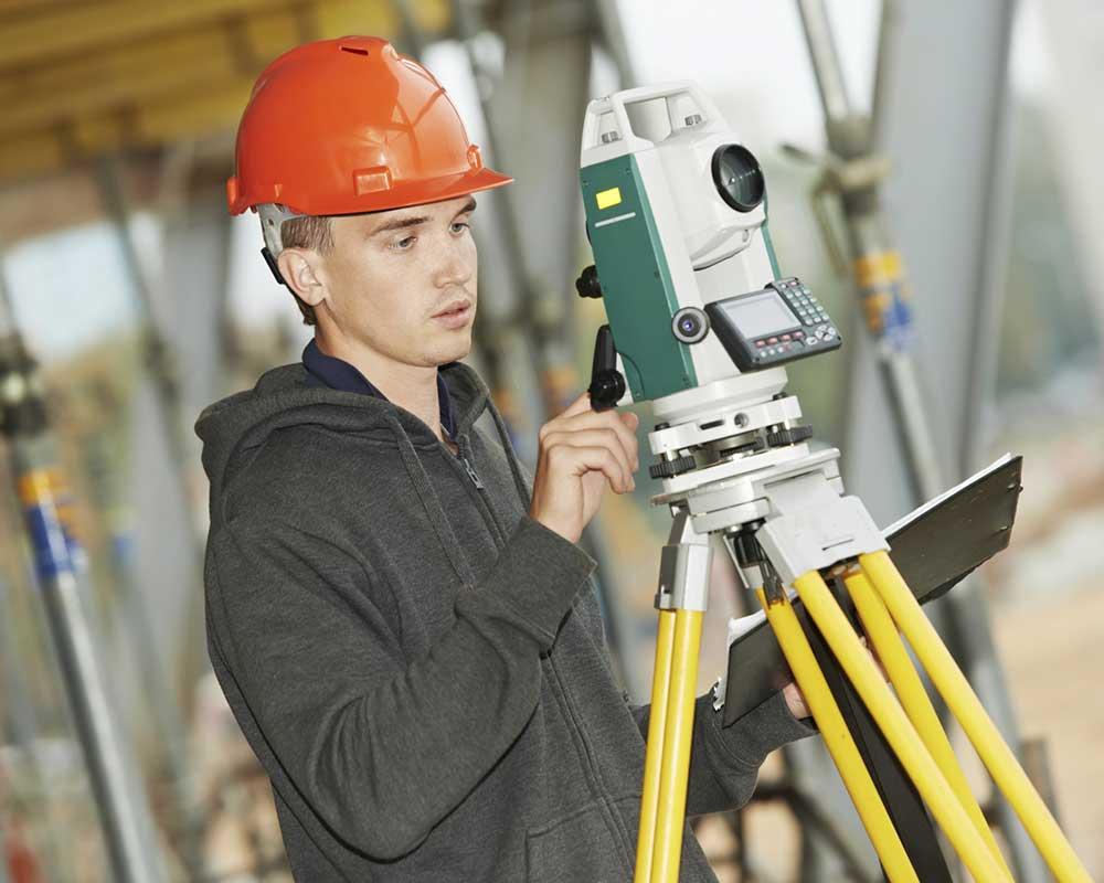 Civil engineer with theodolite