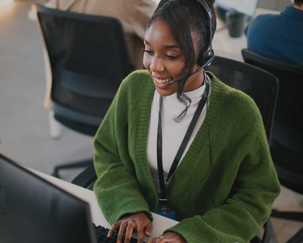 Customer service advisor taking a call from a customer 