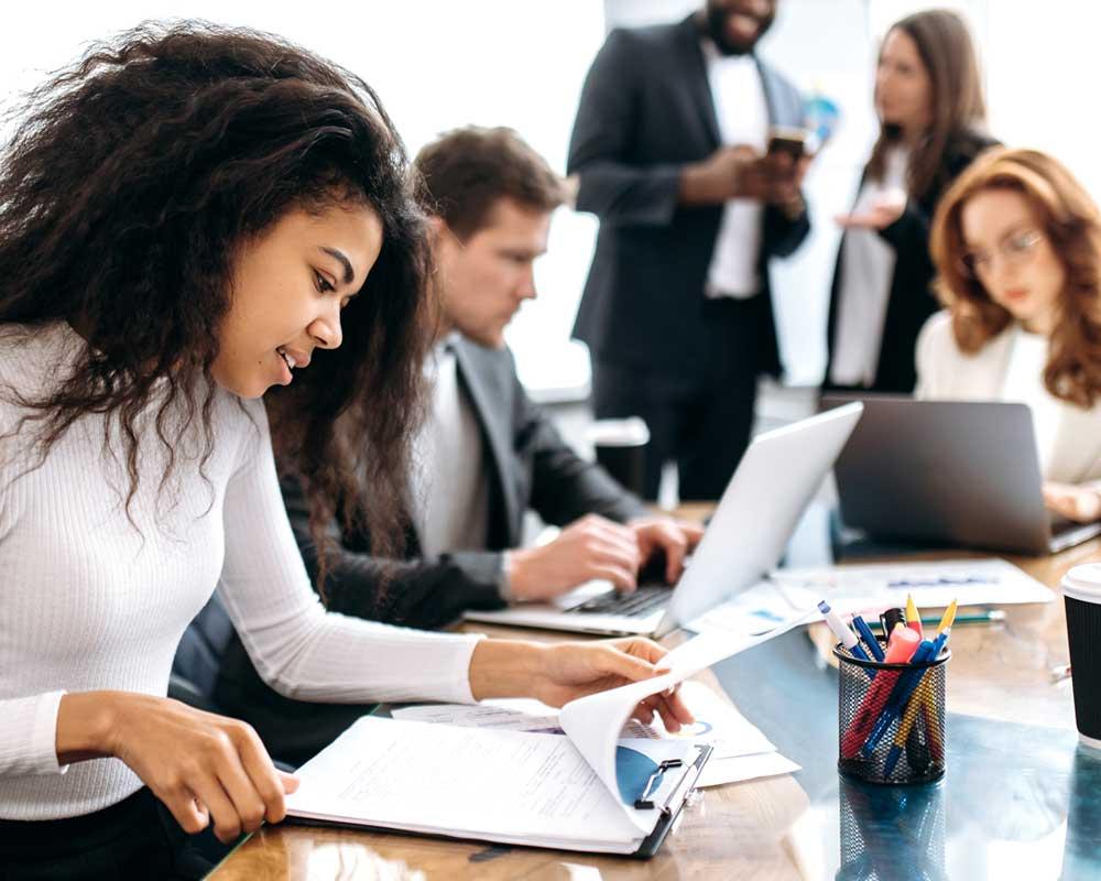 Business services apprentices in a meeting