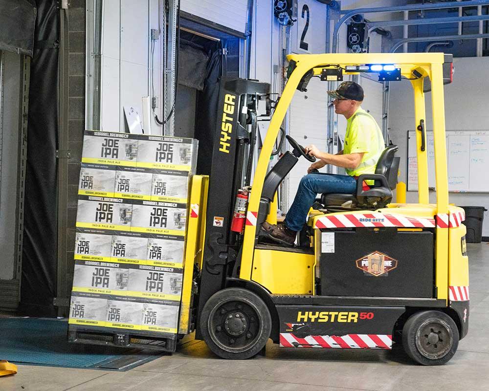 Fork lift truck loaded with boxes