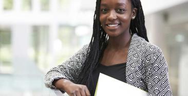 Audit apprentice holding a file